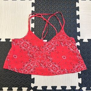 Hollister red printed cropped top with lots of straps on the back in size small